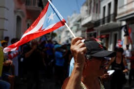 Hundreds of Puerto Ricans protest and demand the resignation of Gov. Wanda Vasquez.