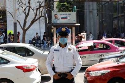 A police officer wears a protective face mask on the street after the governor of the northern Mexican state of Coahuila said on Saturday that a new case of coronavirus had been confirmed, in Mexico City