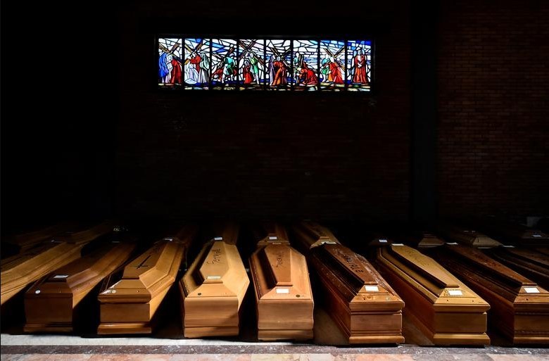 Coffins of people who have died from coronavirus in the church of the Serravalle Scrivia cemetery