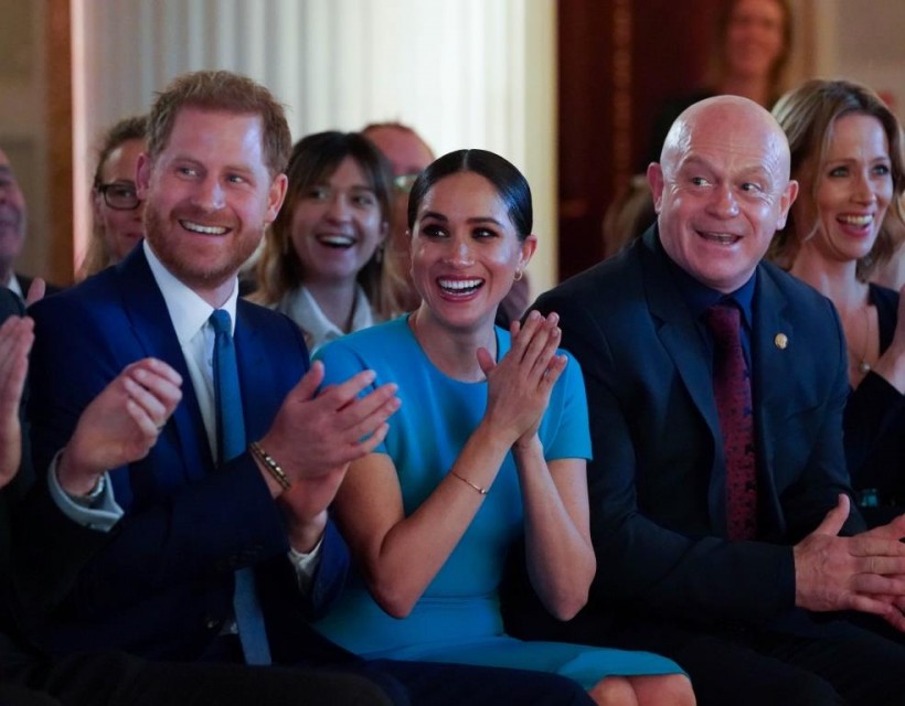 Britain's Prince Harry and his wife Meghan, Duchess of Sussex, sitting next to Ross Kemp, cheer during the annual Endeavour Fund Awards at Mansion House in London.