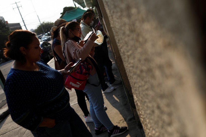 Doctors and nurses who hope to land a job at Mexico's Social Security Institute (IMSS), queue to deal with the novel coronavirus pandemic in Mexico City