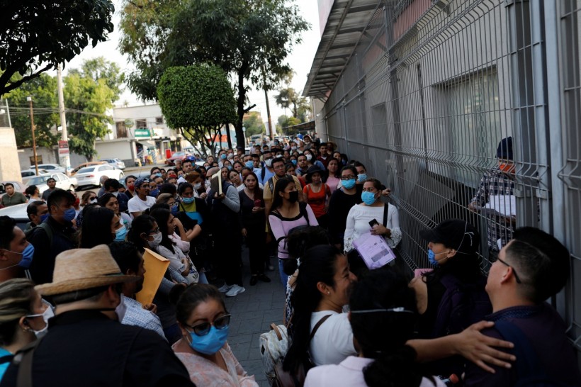 Doctors and nurses who hope to land a job at Mexico's Social Security Institute (IMSS), queue to deal with the novel coronavirus pandemic in Mexico City