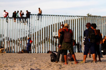 Migrants, part of a caravan of thousands trying to reach the U.S., gather at the border fence between Mexico and the United States after arriving in Tijuana, Mexico November 13, 2018.