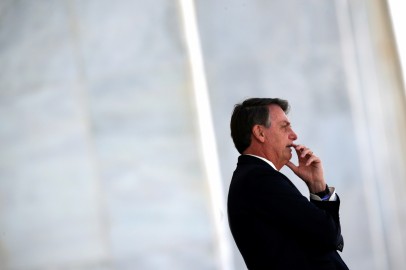 Brazil's President Jair Bolsonaro gestures as he stands at the ramp of the Planalto Palace, in Brasilia