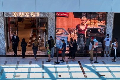 Customers line up to enter a Gucci fashion store at the The Galleria shopping mall after the mall opened during the coronavirus disease (COVID -19) outbreak in Houston
