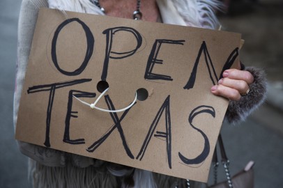 Protesters against the state's extended stay-at-home order demonstrate in Austin