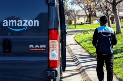 An Amazon worker delivers packages