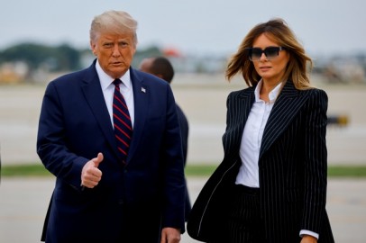 U.S. President Donald Trump walks with first lady Melania Trump at Cleveland Hopkins International Airport in Cleveland