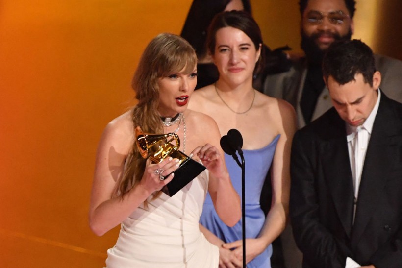 Taylor Swift accepting the award for Album of the Year at the 2024 Grammys