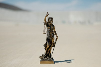 a statue of a lady justice holding a scale