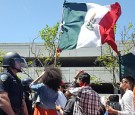 Protesters wave the Mexico flag outside the Hyatt Regency