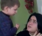 A young boy beats and spits on his mother in shocking video.