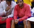  Chris Paul #3 of the Los Angeles Clippers sits on the bench wearing his warm-up top inside out against the Golden State Warriors in Game Four of the Western Conference Quarter