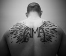 Christopher Wing displays his back tattoo at Louis Neglia presents Proving Grounds Amateur MMA at Essex County College in Newark, New Jersey on January 24, 2009. The WMA logo framed by a pair of wings stands for Wing Martial Arts