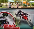 Residents walk to work past a public service announcement banner against the spread of Aedes mosquitoes, a carrier for the Zika virus,