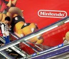 A Nintendo logo and its game characters are displayed at an electronics retail shop in Tokyo on July 29, 2015. Japanese video game giant Nintendo on July 29 said it swung to a 8.28 billion yen (67 million US dollar) net profit in its fiscal first quarter 