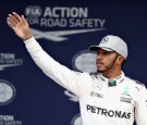 Lewis Hamilton of Great Britain and Mercedes GP waves to the crowds in parc ferme during qualifying for the Formula One Grand Prix of Japan at Suzuka Circuit on October 8, 2016 in Suzuka.