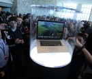 WWDC attendees look at the new MacBook Pro that is displayed at the 2012 Apple WWDC keynote address at the Moscone Center on June 11, 2012 in San Francisco, California. 