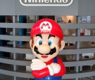 The logo of Japanese gaming giant Nintendo and its game character Super Mario are displayed at a showroom in Tokyo on September 8, 2016. 