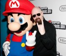 Mario (L) and Judas Priest's Rob Halford (R) attends the 25 years of Mario celebration at the Nintendo World Store on November 12, 2009 in New York City. 