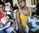 Infants born with microcephaly are held by mothers at a meeting for mothers of children with special needs on June 2, 2016 in Recife, Brazil.