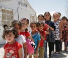 Syrian refugee children take part in activities organised at by the non-profit organization 'Beyond Association' in Saadnayel on July 16, 2016.  