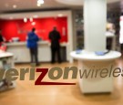 The Verizon Wireless logo is displayed on a window at a retail store in Washington, D.C., U.S., on Thursday, Oct. 23, 2014.