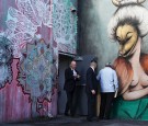 Florida Governor Rick Scott exits from a door after holding a press conference during a visit to the Wynwood neighborhood to announce that the area's Zika zone is expected to be lifted.