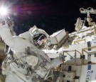 IN SPACE - SEPTEMBER 5: In this handout from National Aeronautics and Space Administration or NASA, NASA astronaut Sunita Williams, Expedition 32 flight engineer, raises her hand during the mission's third session of extravehicular activity (EVA) Septembe