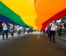 Flag bearers carry a massive gay rainbow flag as they lead out the annual pride parade. More than 100 000 people took to the streets to celebrate LGBT Pride in Taipei