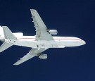 A Pegasus XL rocket is attached to an L-1011 aircraft