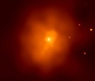 The cluster of galaxies EMSS 1358+6245 about 4 billion light year away from Earth in the constellation Draco is shown in this Chandra image. 