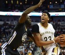 Anthony Davis #23 of the New Orleans Pelicans drives to the basket against Draymond Green #23 of the Golden State Warriors