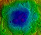 This image from NASA's Dawn mission shows the topography of the northern and southern hemispheres of the giant asteroid Vesta, updated with pictures obtained during Dawn's last look back.