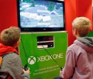 Children play the video game 'Minecraft' on Microsoft Xbox One console during the 'Paris Games Week'on October 27, 2016 in Paris, France.