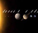 An artist's rendition shows the solar system with 12 planets, including three new ones to be added if astronomers meeting in the Czech capital approve a new planetary definition.