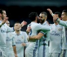 Karim Benzema of Real Madrid CF celebrates scoring their opening goal with teammates during the La Liga match between Real Madrid CF and Athletic Club de Bilbao at Estadio Santiago Bernabeu