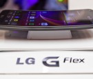 A curved screen LG G Flex smartphone sits on display at the LG Electronics Inc. pavilion on day two of the Mobile World Congress in Barcelona, Spain, on Tuesday, Feb. 25, 2014. Top telecommunication managers will rub shoulders in Barcelona this week at th