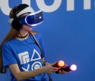 A woman plays a video game with a virtual reality head-mounted headset 'PlayStation VR' developed by Sony Interactive Entertainment during the 'Paris Games Week' on October 27, 2016 in Paris, France. 