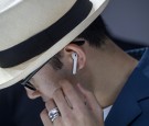 An attendee wears the Apple Inc. AirPod wireless headphones during an event in San Francisco, California, U.S., on Wednesday, Sept. 7, 2016. 