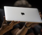 An attendee displays the new MacBook Pro laptop computer during an event at Apple Inc. headquarters in Cupertino, California, U.S., on Thursday, Oct. 27, 2016. 