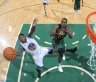 Nate Robinson #2 of the Golden State Warriors pulls down a rebound over Paul Millsap #24 of the Utah Jazz at Energy Solutions Arena on March 17, 2012 in Salt Lake City, Utah.