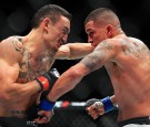 Max Holloway (L) of the United States fights Anthony Pettis (R) of the United States for the Interim Featherweight Title during the UFC 206 event at Air Canada Centre on December 10, 2016 in Toronto, 