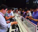 Attendees use LG's new premium smartphone V20 during a launch event in Seoul on September 7, 2016.