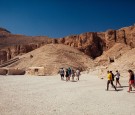 A small group of tourists walk toward the entrance to a tomb in The Valley of the Kings on October 23, 2013 in Luxor, Egypt. 