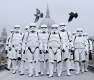 People dressed as Stormtroopers from the Star Wars franchise of films pose on the Millennium Bridge to promote the latest release in the series, 'Rogue One', on December 15, 2016 in London, England.