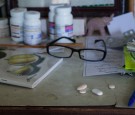 HIV medication is seen on a table inside one of the houses of the community on September 6, 2014 in Tuol Sambo, Cambodia. 