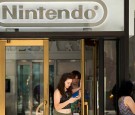 People exit Nintendo's flagship store, July 11, 2016 in New York City. The success of Nintendo's new smartphone game, Pokemon Go, has sent shares of Nintendo soaring.