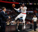 Paul Millsap #4 of the Atlanta Hawks leaps to save a ball from going out of bounds against the Atlanta Hawks at Philips Arena on November 9, 2016 in Atlanta, Georgia.