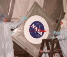 383623 01: Workers in the Space Station Processing Facility place the NASA logo on the U.S. Laboratory Destiny, the key U.S. element of the International Space Station December 21, 2000, at the Kennedy Space Center, FL. Launch of mission STS-98 on the Spa